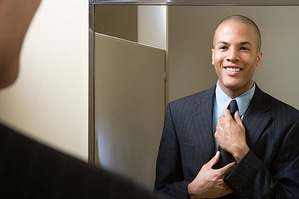 Picture of man fixing his tie before an interview