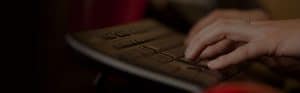 person typing on keyboard