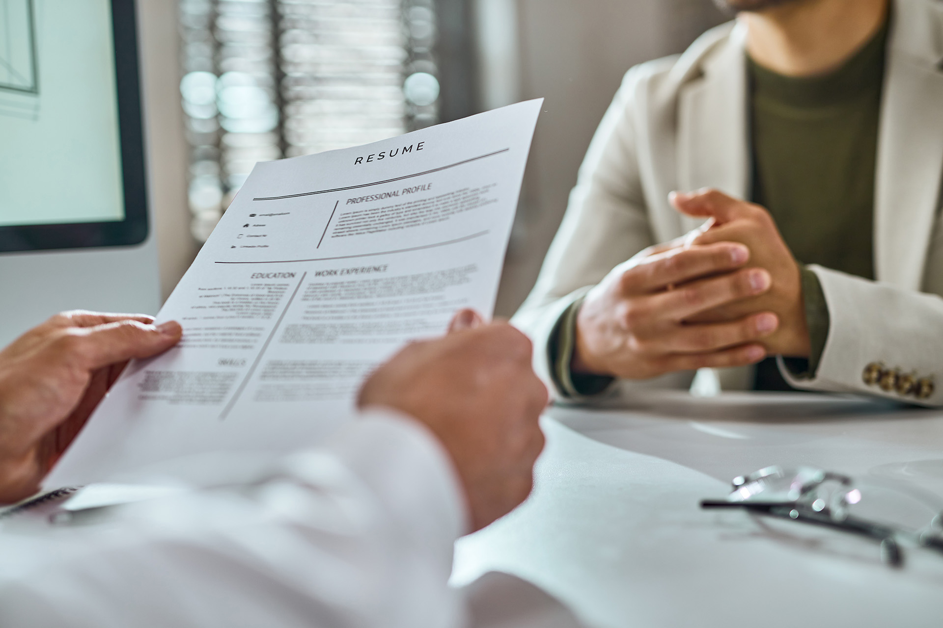 10 Resume Tips man holding a resume