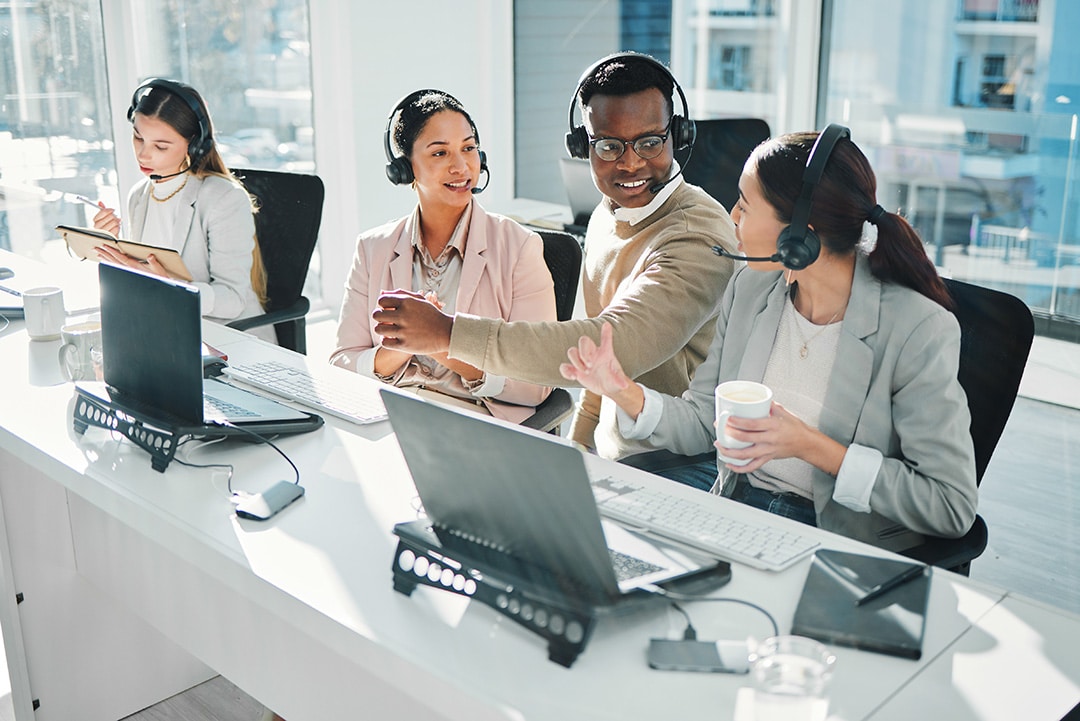 Call center team talking to team leader Florida Call Center Staffing Team Hero Image