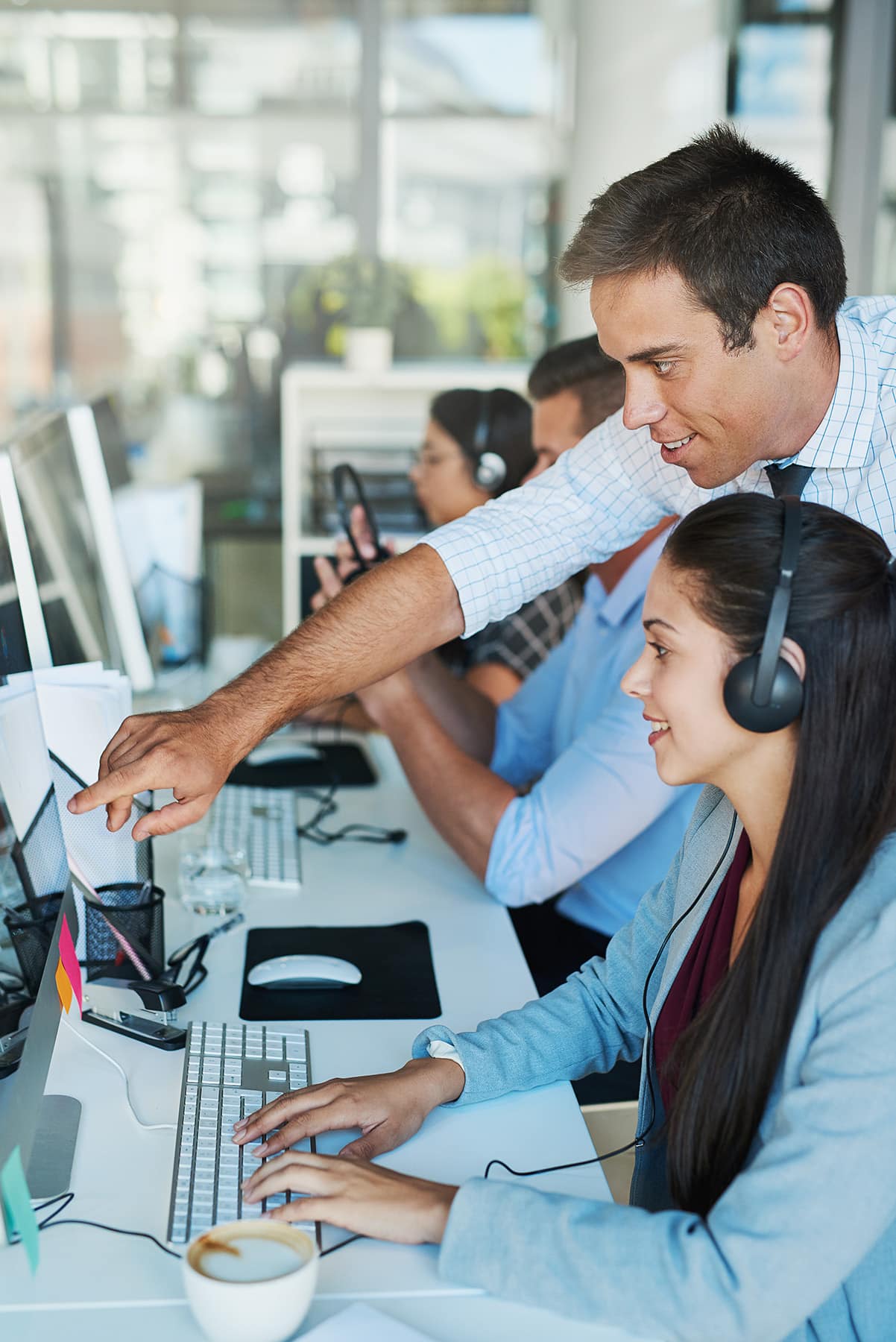 Call Center Manager walking new employee through first-day schedule